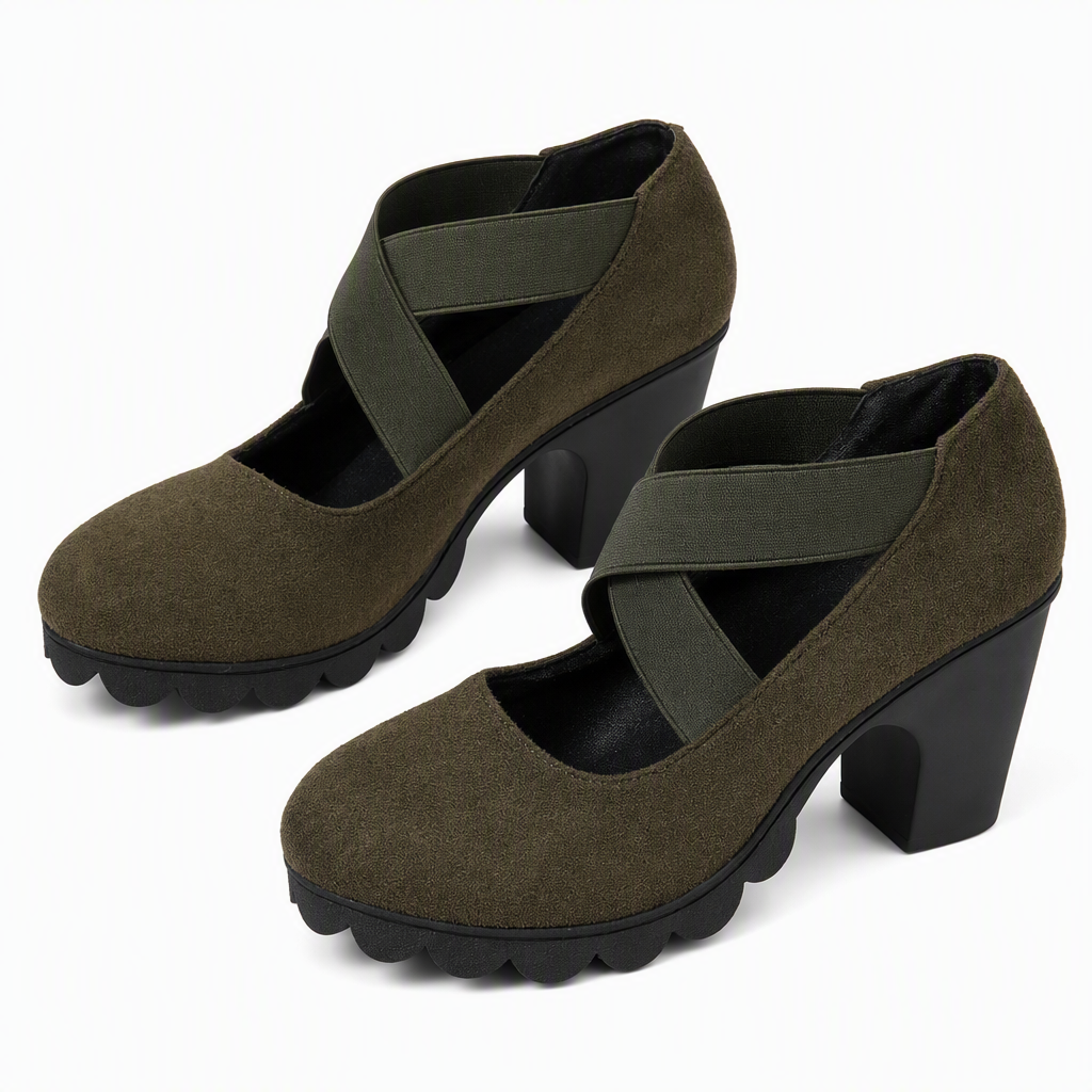 Pair of olive green suede-look block heel shoes with dark green crossed elastic straps and black scalloped soles. 10