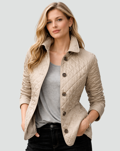 Model wearing the beige quilted jacket with brown buttons over a grey top and dark jeans, hands resting in the pockets. 3