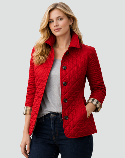 Model wearing the red quilted jacket with black buttons over a grey tee and dark jeans, with check lining on the turned-back cuffs. 4