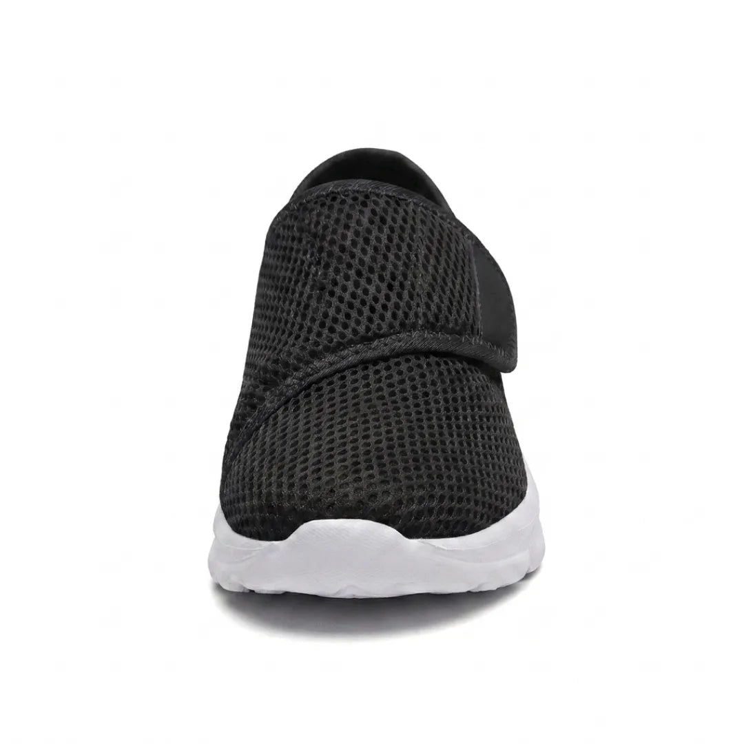 Front view of a black mesh shoe showing the wide rounded toe and strap across the foot 26