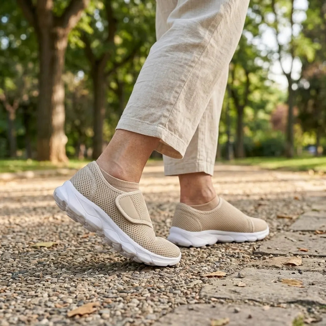 Person in beige linen trousers walking on a gravel park path wearing the beige mesh shoes 29