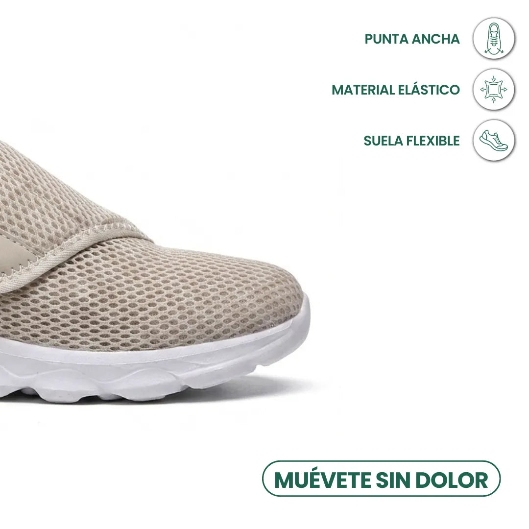 Close-up of the beige mesh toe box and white sole with icons for wide toe and flexibility 32