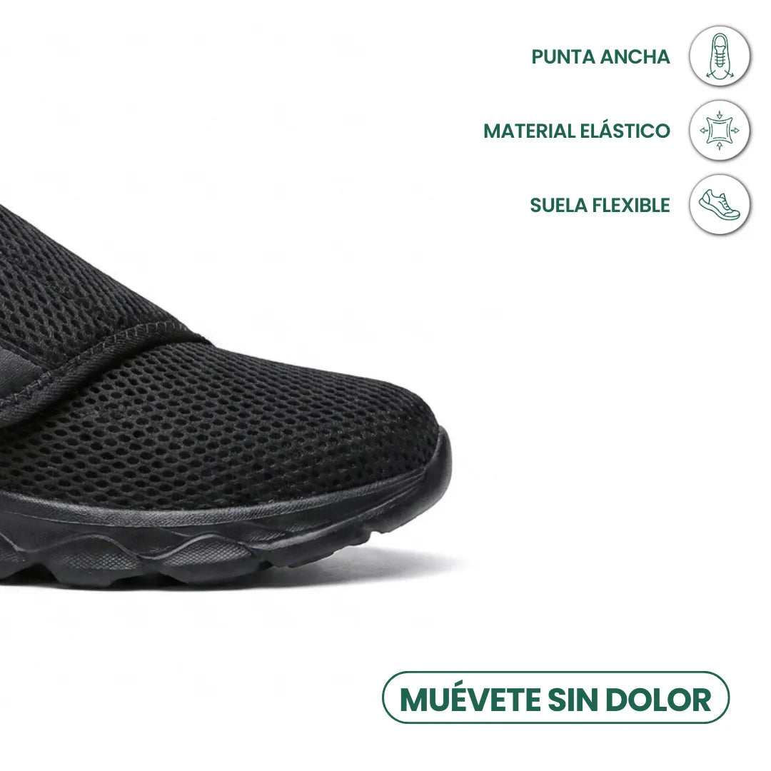 Close-up of the black shoe's wide toe box and flexible sole, with feature icons 14