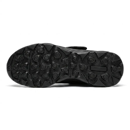 Black rubber outsole with a studded grip pattern, seen from underneath 18
