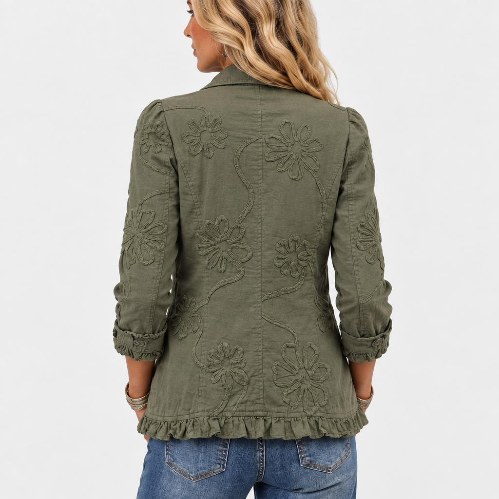 Back view of the olive green jacket showing large embroidered flowers and a ruffled hem 5