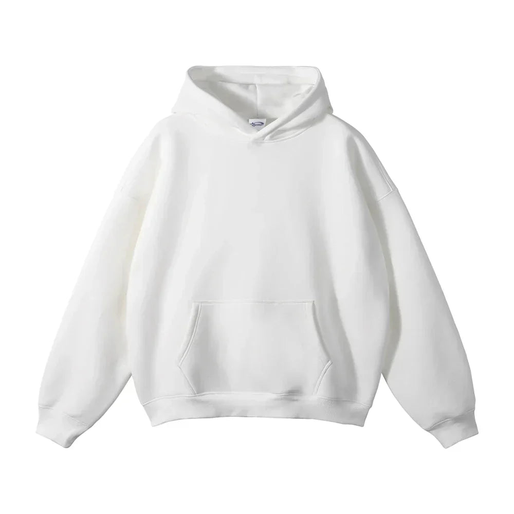 Plain white pullover hoodie laid flat, front view, showing the hood, dropped shoulders, ribbed cuffs and hem, and large front pouch pocket. 14