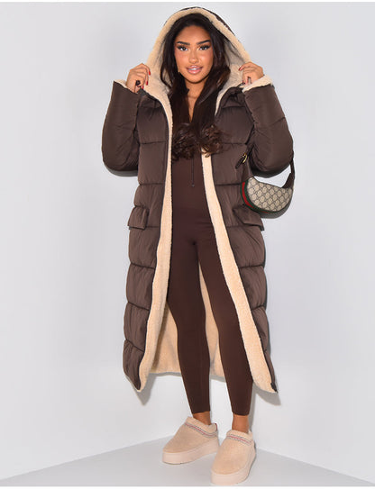Model in the brown puffer side worn open with the hood up, showing the cream fleece lining and front flap pockets. 2