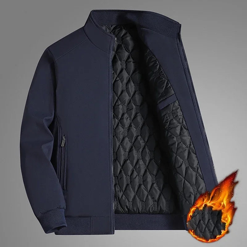 Navy blue version of the jacket unzipped to show the diamond-quilted lining, with a flame graphic suggesting warmth. 3