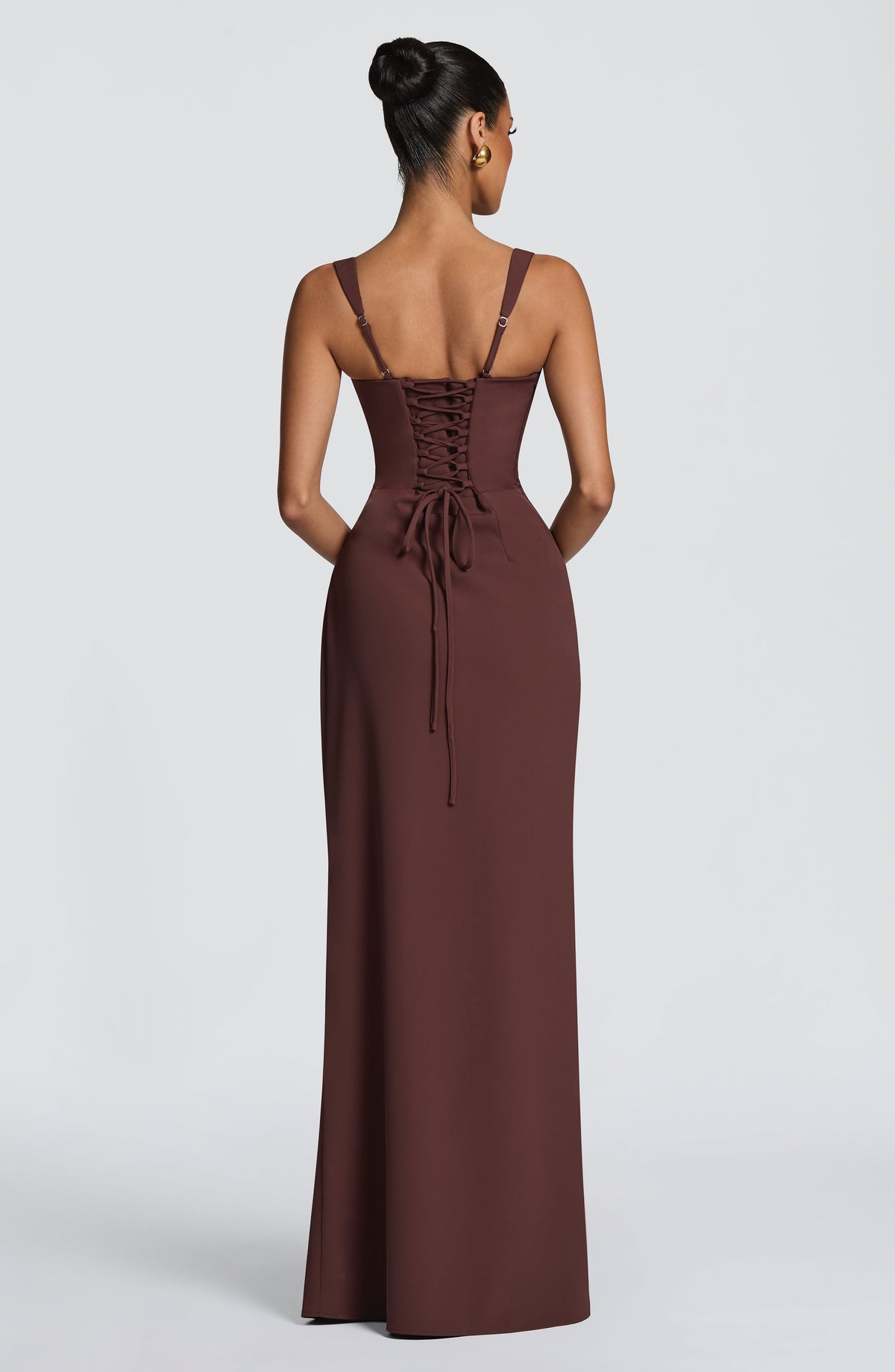 Back view of the brown maxi dress showing corset-style lace-up back and thin adjustable straps. 2