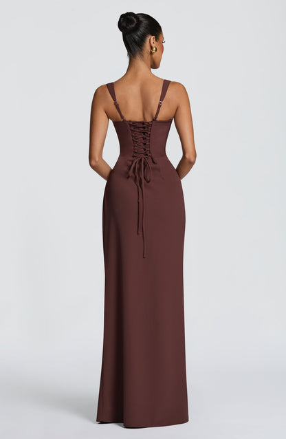Back view of the brown maxi dress showing corset-style lace-up back and thin adjustable straps. 2