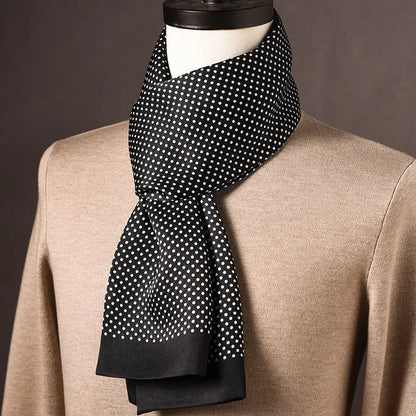 Black silk scarf with small white polka dots and plain black ends, draped on a mannequin over a beige jumper. 14