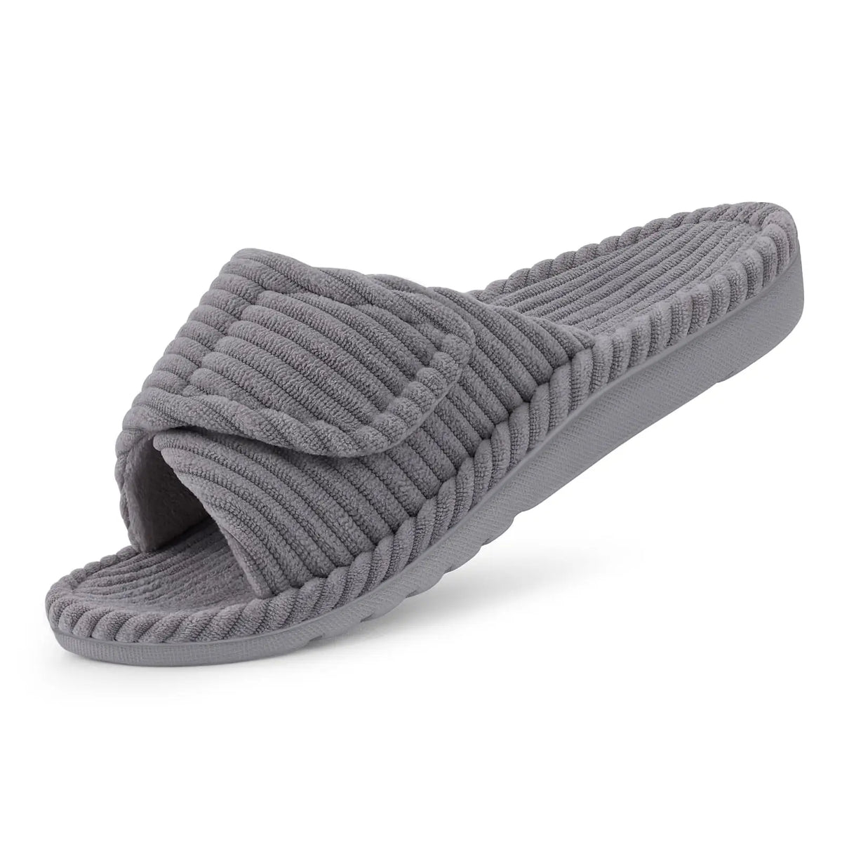 Single grey ribbed open-toe slide slipper with a folded adjustable strap, shown at an angle on a white background. 9