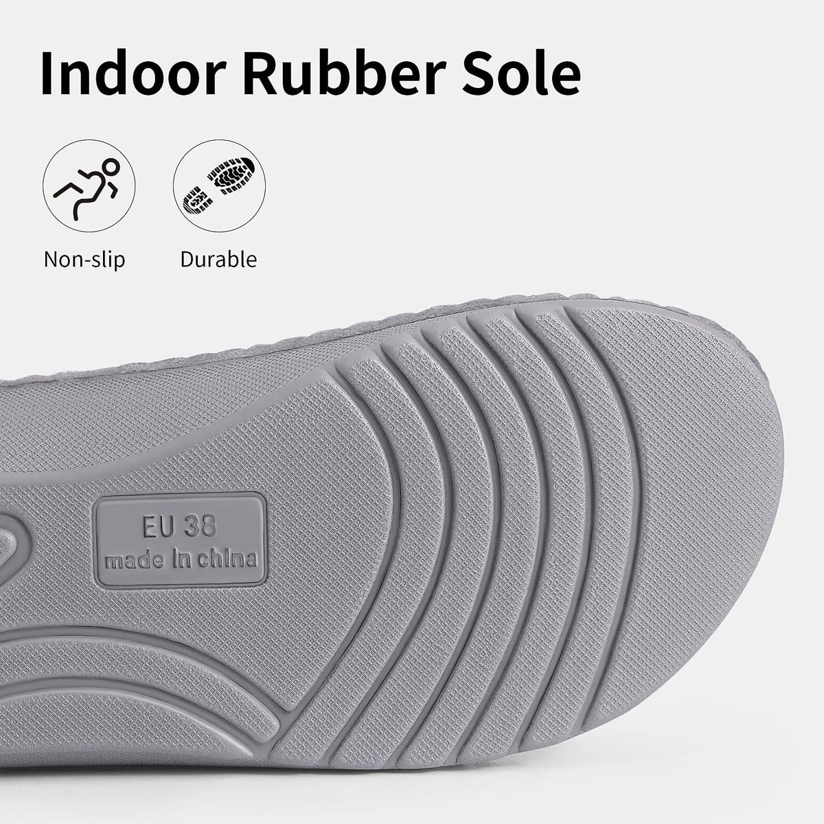Underside of the slipper showing the grey curved-tread rubber outsole with a raised sole-size marking, shown close up. 4
