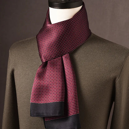 Burgundy silk scarf with a small woven-look dotted pattern and plain black ends, draped on a mannequin over an olive jumper. 6