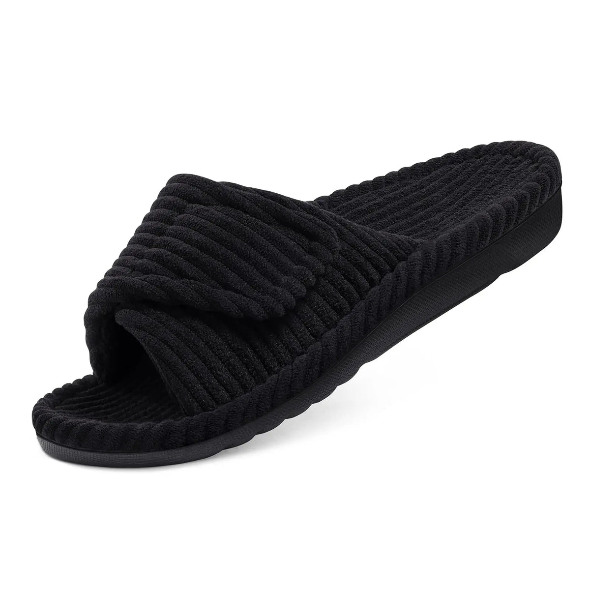 Single black ribbed open-toe slide slipper with a folded adjustable strap and thick sole, shown at an angle on white. 8