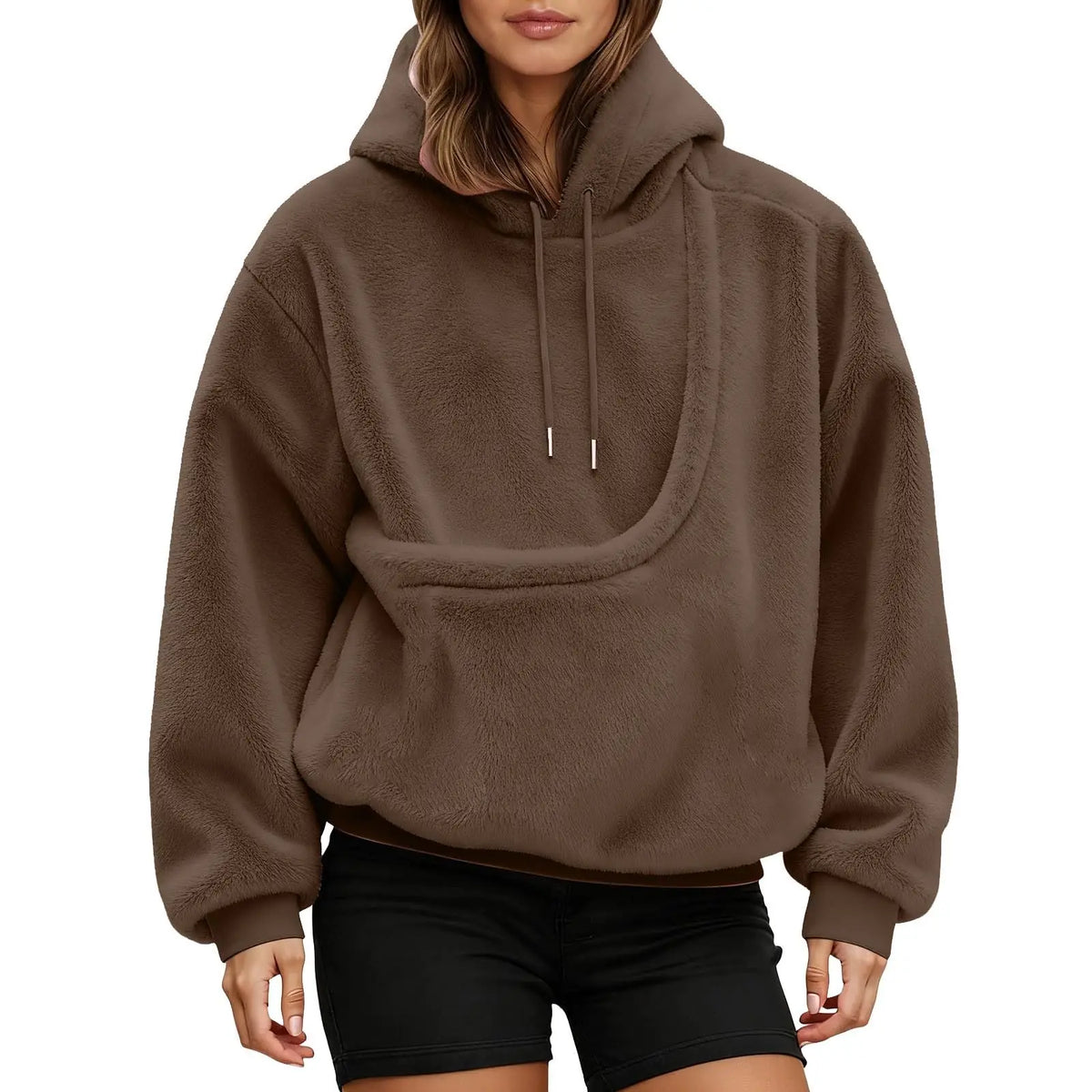 Front view of a brown fluffy hoodie on a model, showing the empty curved kangaroo pouch and drawstring hood. 10