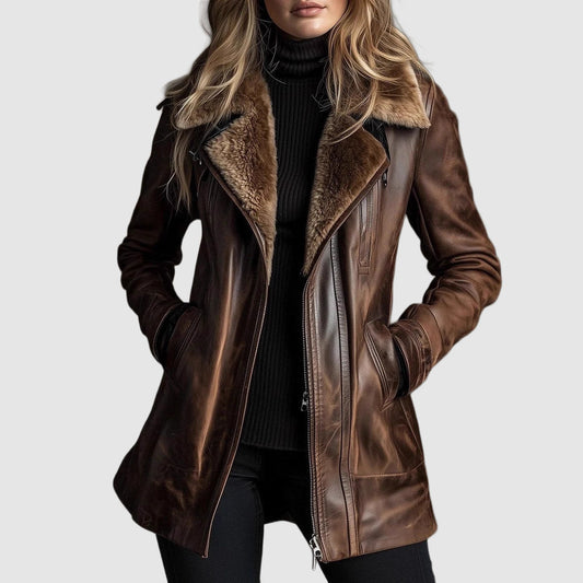 Model wearing the brown leather jacket open at the front over a black roll-neck, hands in pockets 1
