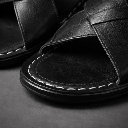Close-up of the black sandal toe area, showing the textured strap surface, white stitching and the layered black sole edge. 8