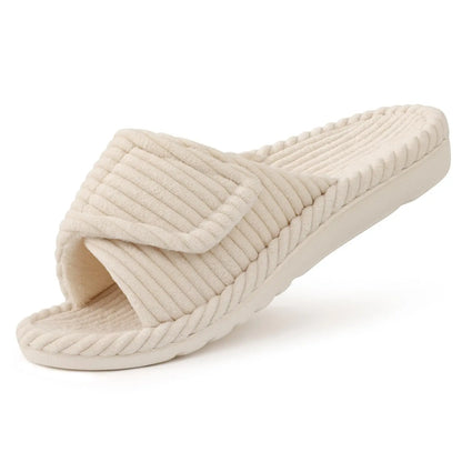 Single cream ribbed open-toe slide slipper with an adjustable folded strap, shown at an angle on a white background. 7