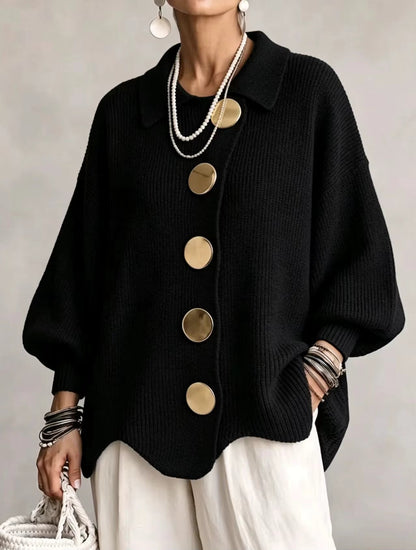 Front view of the black version on a model, with five big gold buttons, ribbed knit and balloon sleeves. 3