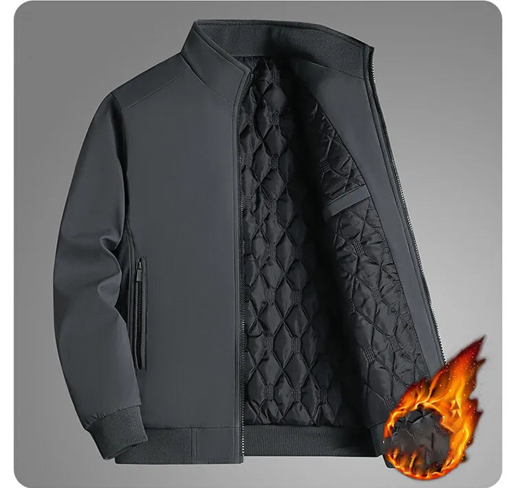 Grey jacket unzipped on a grey background, showing the quilted lining and side zip pocket, with a flame graphic. 11