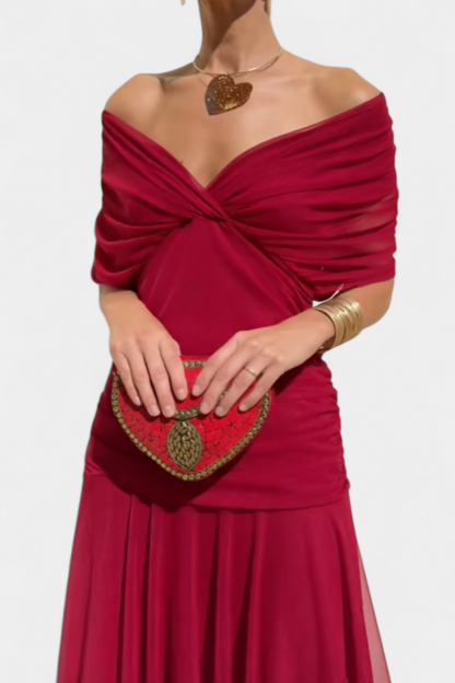 Close-up of the deep red version, showing the draped, twisted off-the-shoulder neckline and ruched waist. 11