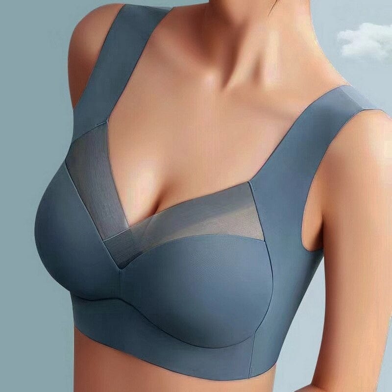Model wearing the bra in slate blue, front view showing mesh panels and smooth cups 2