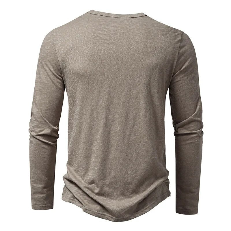 Back view of the taupe-grey long-sleeved henley, plain with a round neckline and curved hem 3