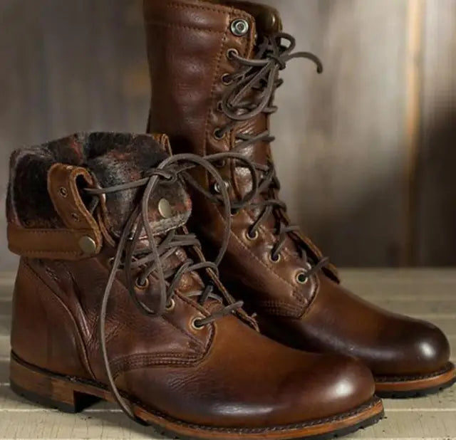 Pair of brown leather lace-up boots, one with its patterned lined cuff folded down, showing the laces and stitched leather. 3