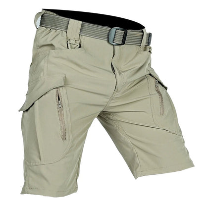 Light khaki cargo shorts shown at an angle with a matching webbing belt and a plastic buckle, with zipped thigh pockets visible. 3