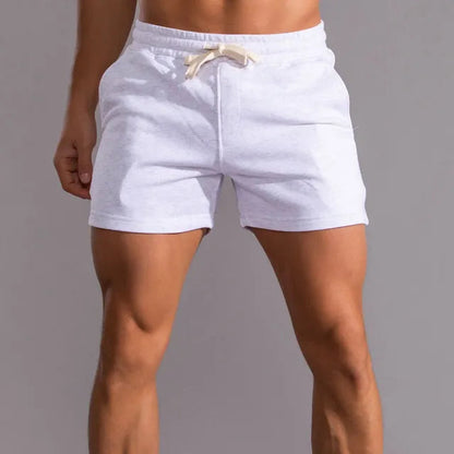 White marl jersey shorts with a cream drawstring and elasticated waistband, shown on a model from the front. 2