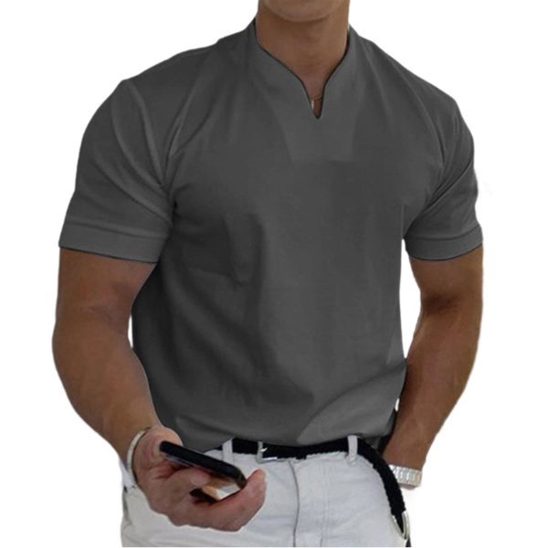 Dark grey short-sleeved V-neck tee on a model with white trousers, belt and phone in hand. 3