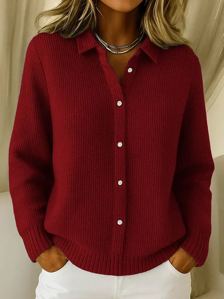The textured collared jumper in deep burgundy red, shown from the front on a model with hands in pockets. 3