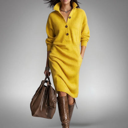 Front view of the mustard yellow knitted dress with three buttons, worn with brown boots 10