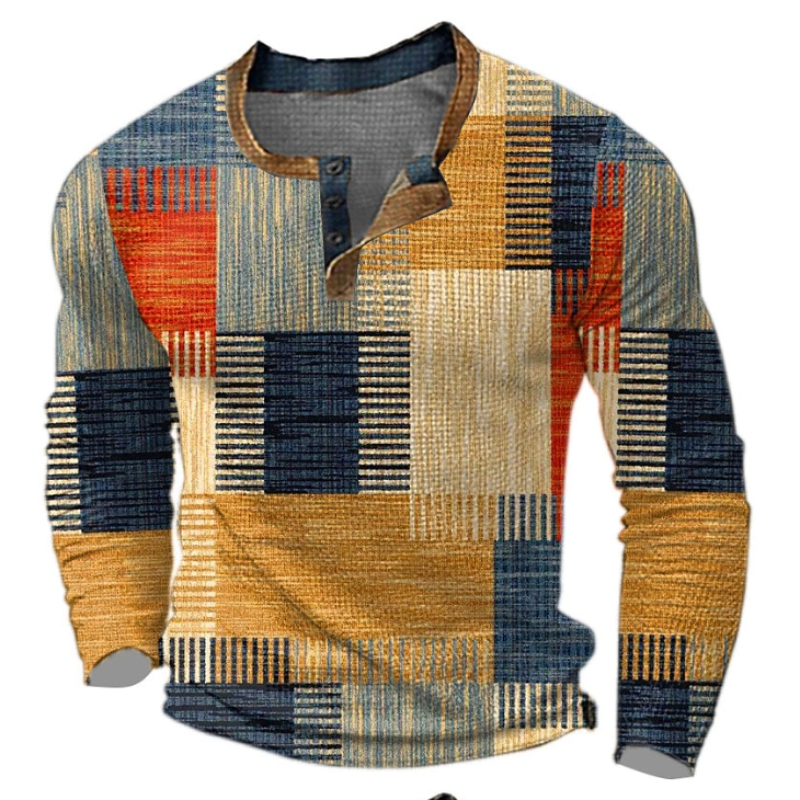 Long-sleeved Henley top in orange, mustard, navy and cream colour-block patchwork with striped texture, tan collar trim and three buttons, front view. 1