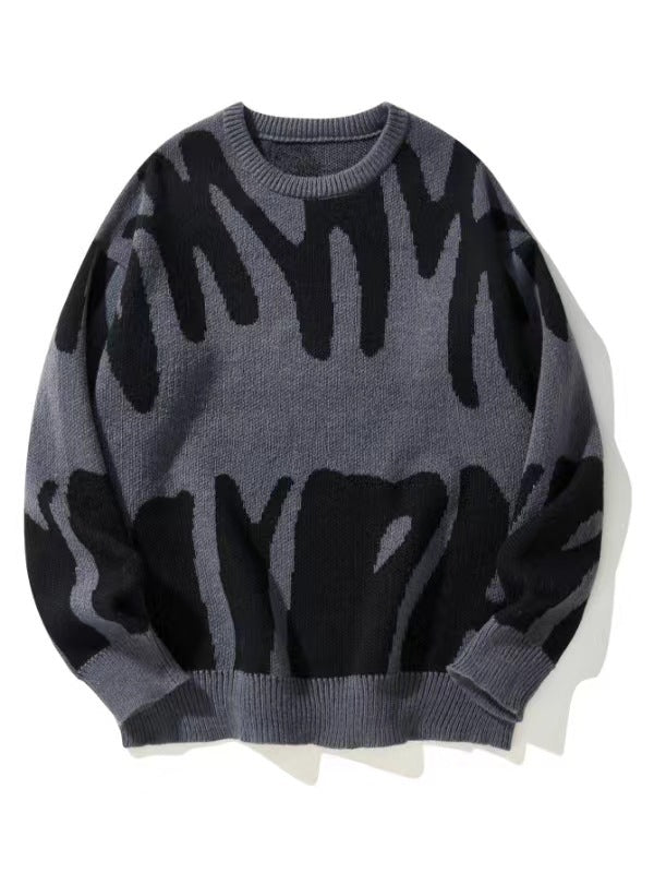 Flat lay of the knitted jumper in grey with a bold black abstract pattern 1