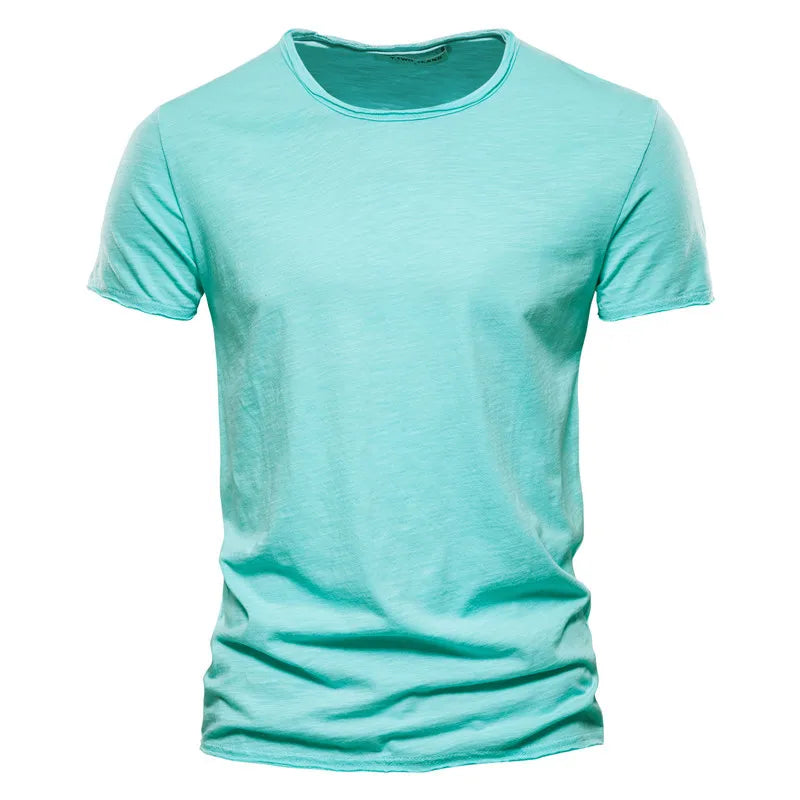 Front view of the short-sleeved crew-neck t-shirt in bright aqua green, with a raw-edged neckline and softly textured fabric. 10