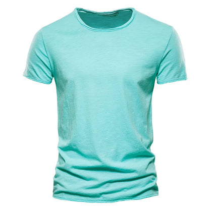 Front view of the short-sleeved crew-neck t-shirt in bright aqua green, with a raw-edged neckline and softly textured fabric. 10