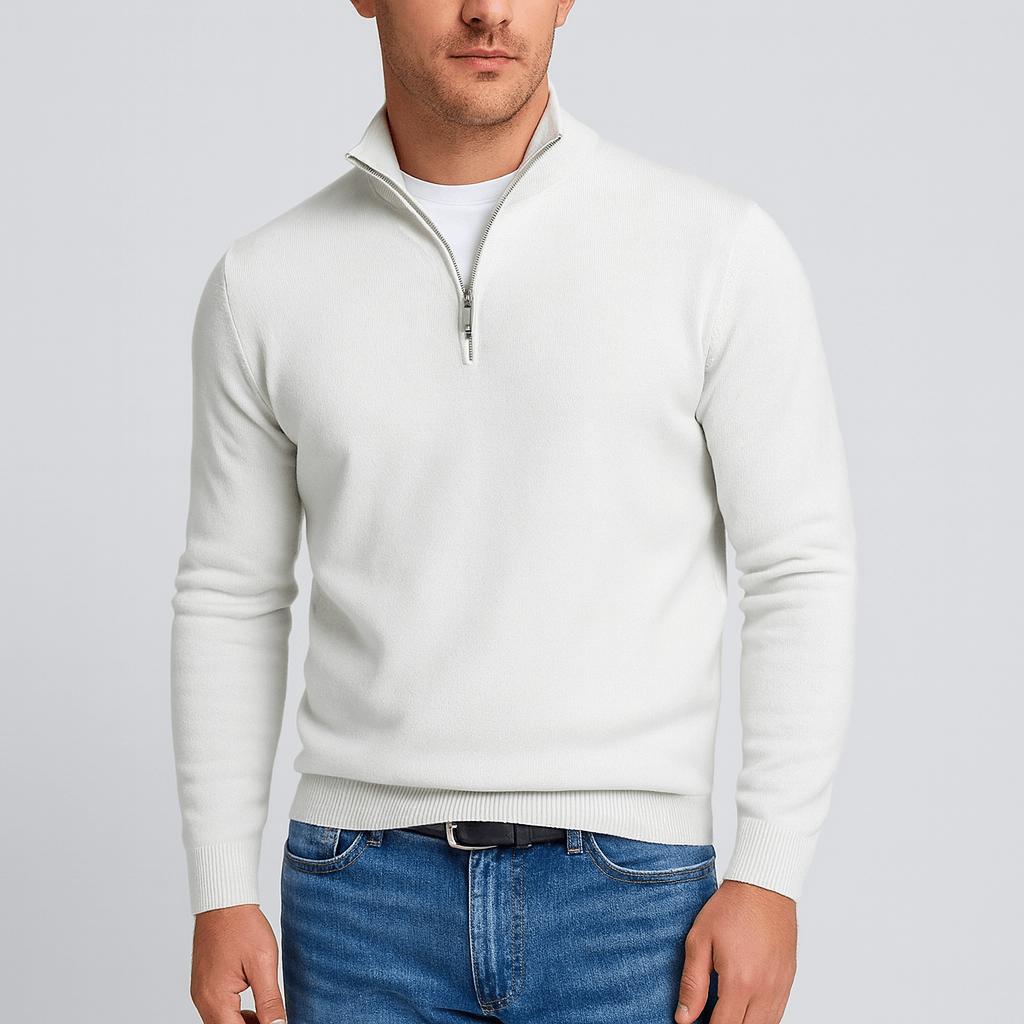 Man wearing a white quarter-zip knit jumper over a white tee, with blue jeans and a black belt, front view. 2
