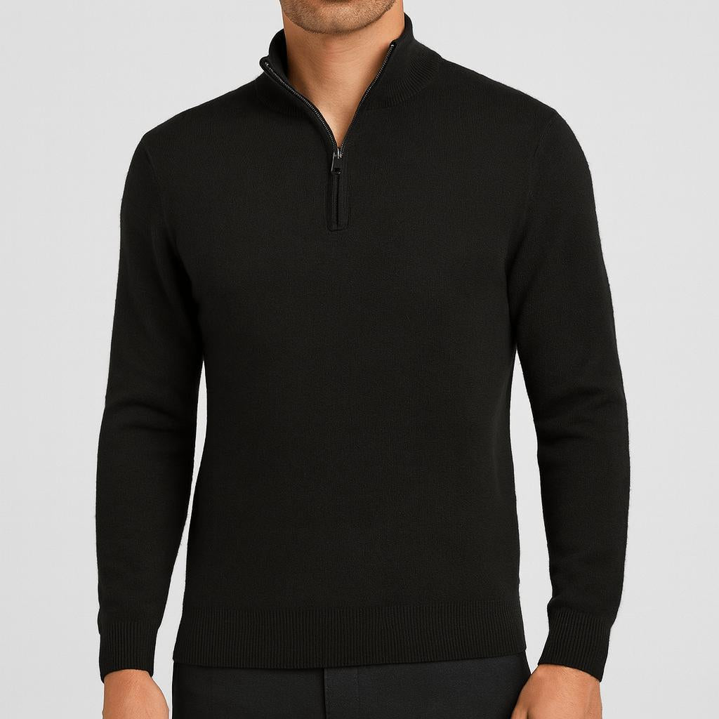 Man wearing a black quarter-zip knit jumper with a black zip and dark trousers, front view. 3
