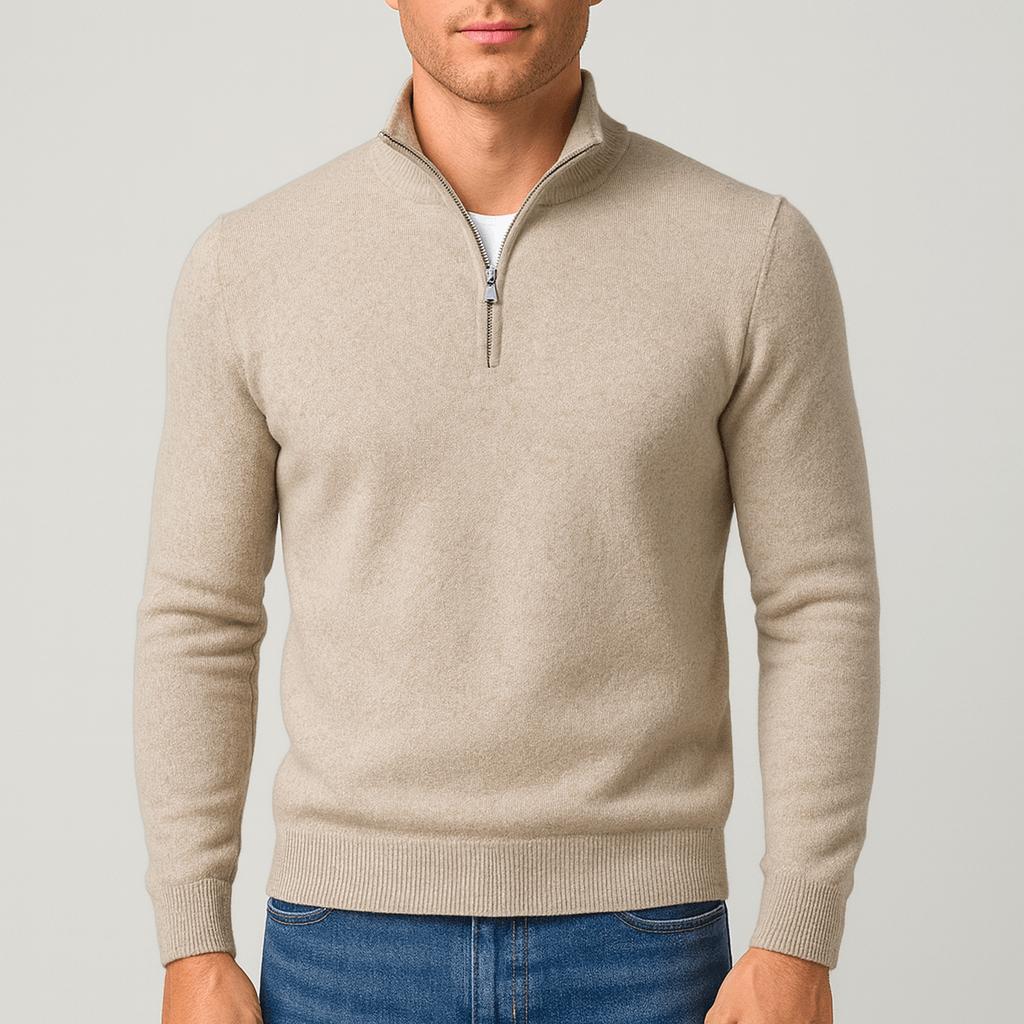 Man wearing a beige quarter-zip knit jumper with ribbed cuffs and hem, styled with blue jeans, front view. 9