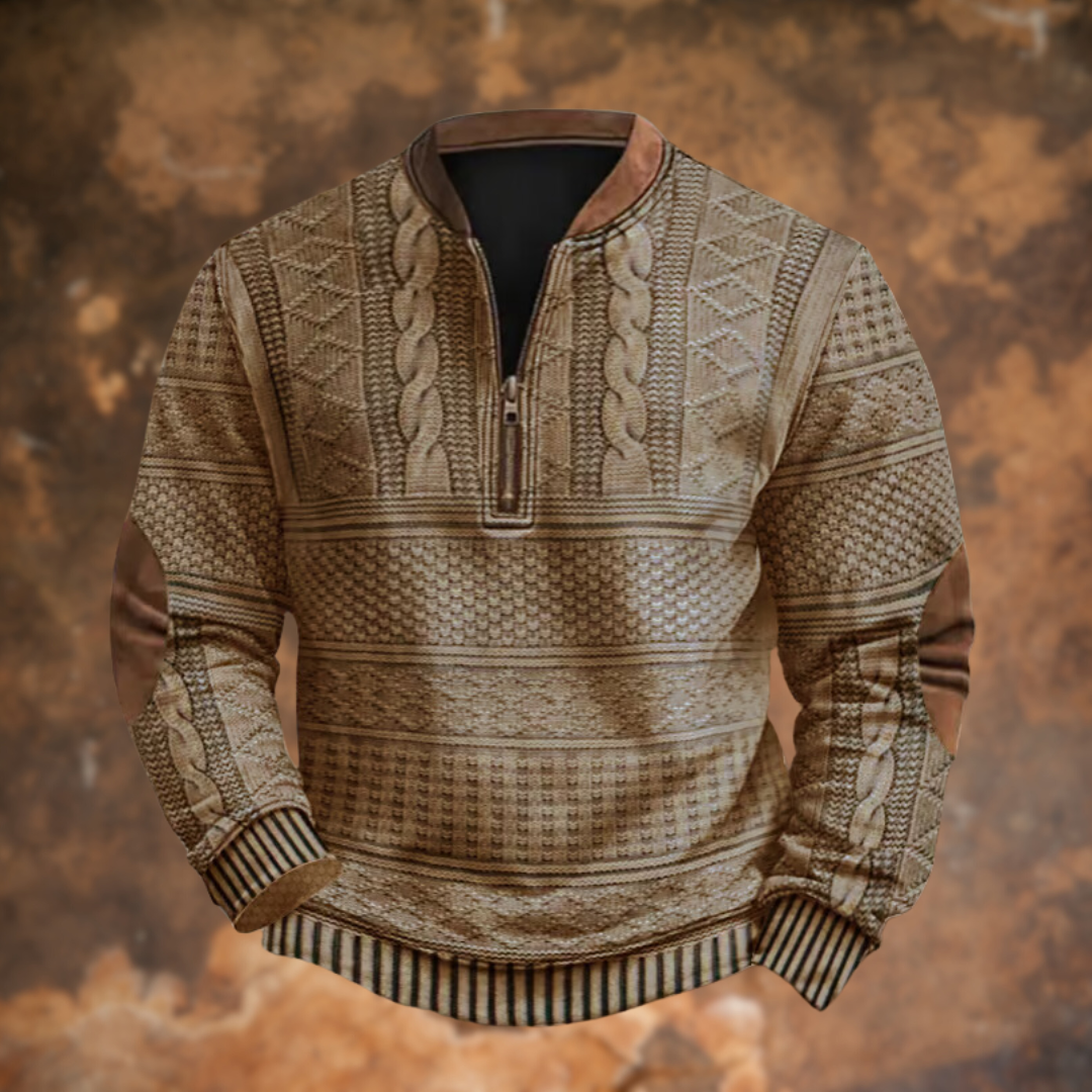 Front view of the quarter-zip jumper in a sandy beige, with patterned knit bands, striped cuffs and hem, and brown elbow patches. 3