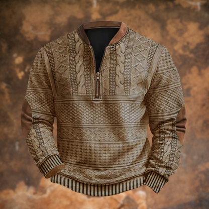 Front view of the quarter-zip jumper in a sandy beige, with patterned knit bands, striped cuffs and hem, and brown elbow patches. 3