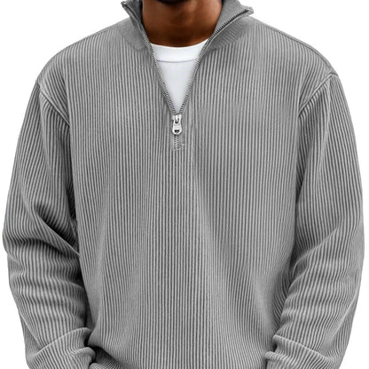 Front view of the ribbed half-zip pullover in grey, worn over a white tee, with silver zip and stand collar. 6