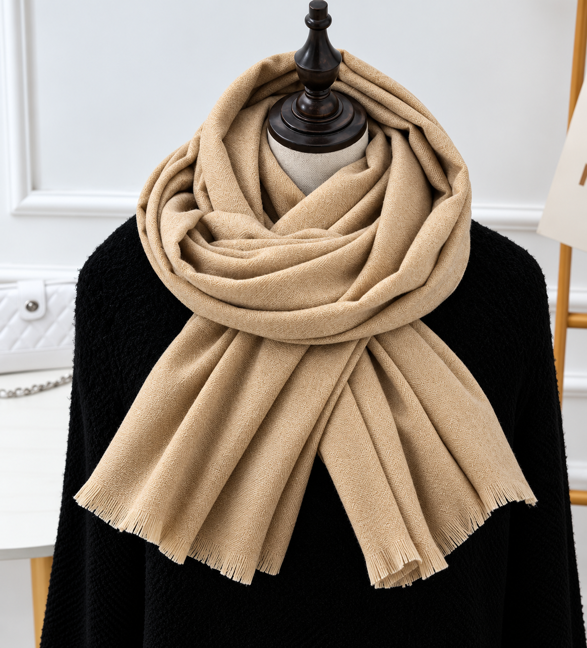 Sand-coloured scarf with a fine woven texture and fringed ends, draped on a mannequin 4