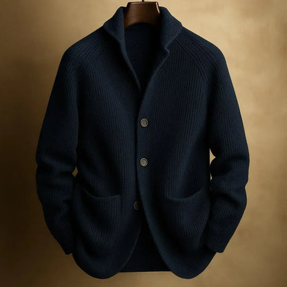 Navy blue ribbed knit cardigan with shawl collar and two front pockets on a hanger 3