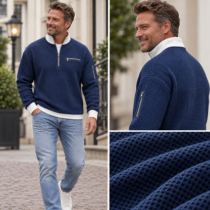 Collage of the navy waffle-knit jumper: man walking down a cobbled street, a back view of the collar and sleeve zip, a close fabric texture. 2