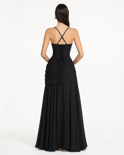 Back view of the black maxi dress, showing the lace-up corset back and crossed thin straps. 15