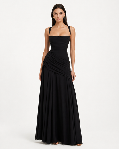 Front view of the black maxi dress, showing the square neckline, gathered waist and flowing skirt. 18