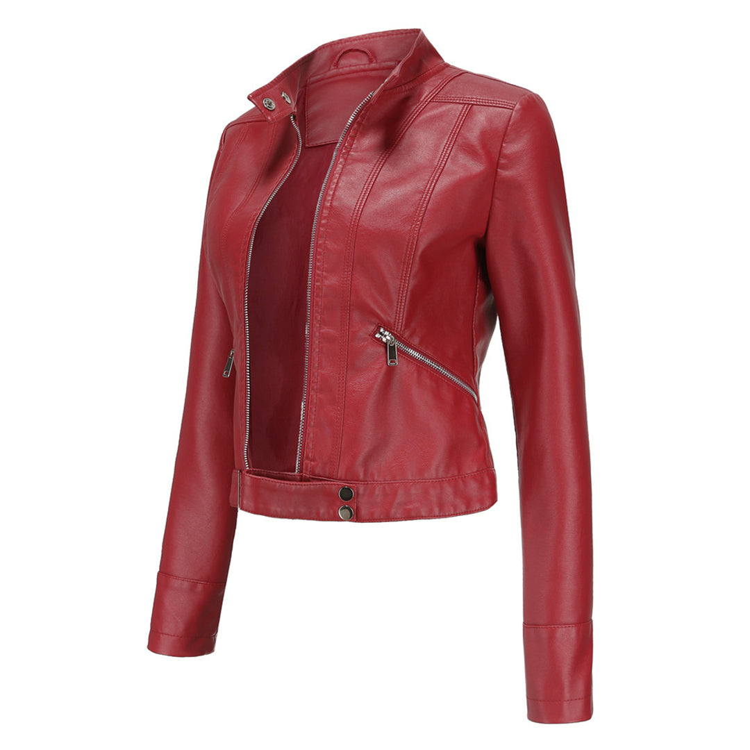 Three-quarter side view of the red jacket, unzipped, showing collar studs, diagonal zip pocket and snap-fastened hem. 10